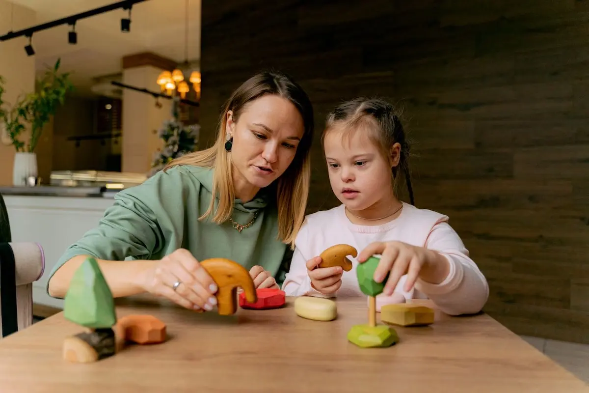 Therapist and child engaging in a speech therapy activity while considering "Is Speech Therapy Covered by Medicare"