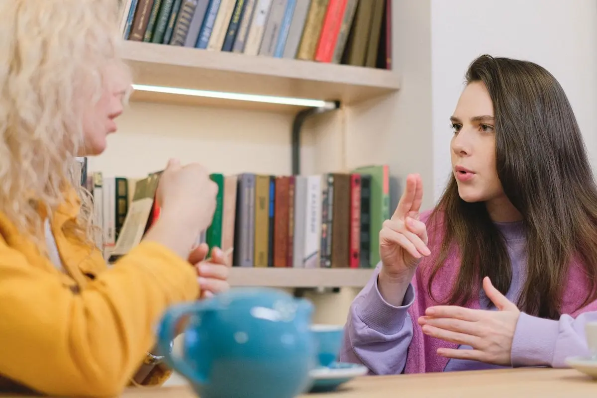 A speech therapist answering a patient's question of "can speech pathologists diagnose medical conditions?"
